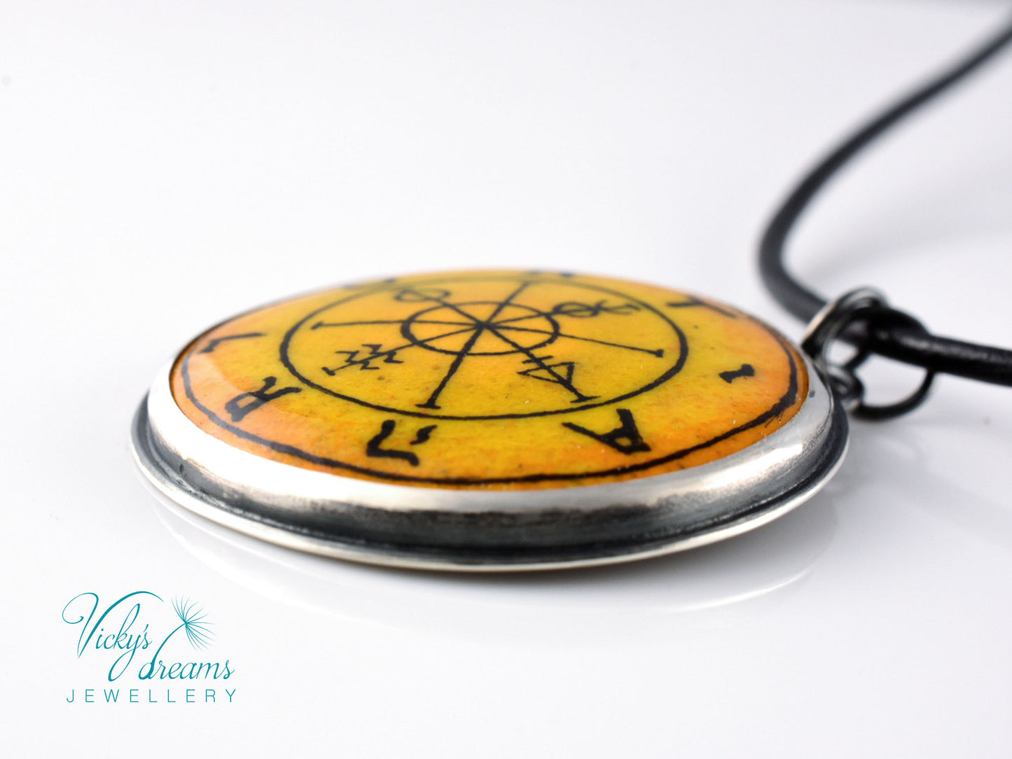 Hand painted enamel Wheel of Fortune tarot pendant in sterling silver and copper with leather cord
