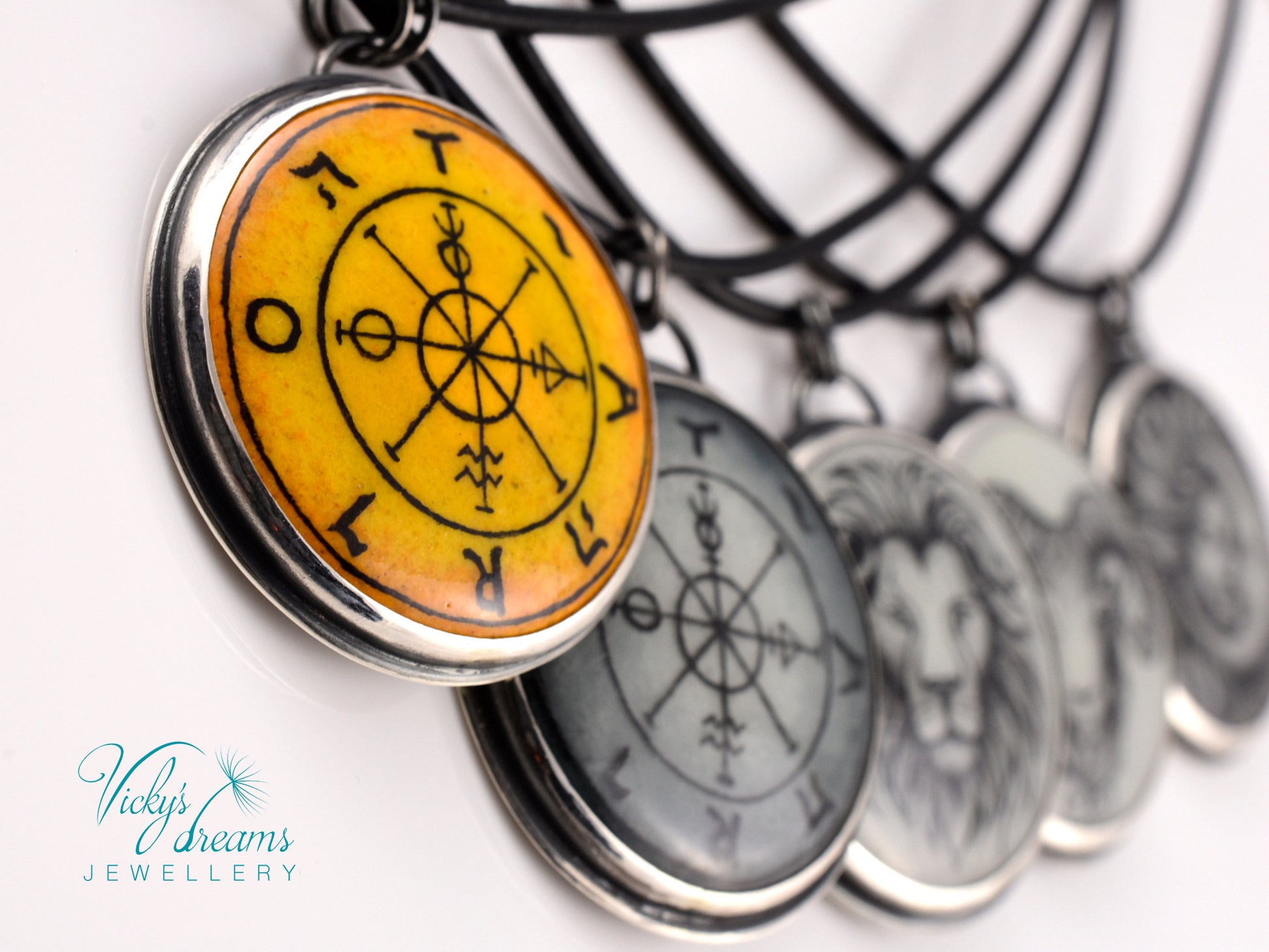 Hand painted enamel Wheel of Fortune tarot pendant in sterling silver and copper with leather cord