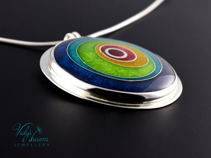 Handmade cloisonné enamel circles pendant in vibrant colors with sterling silver bezel