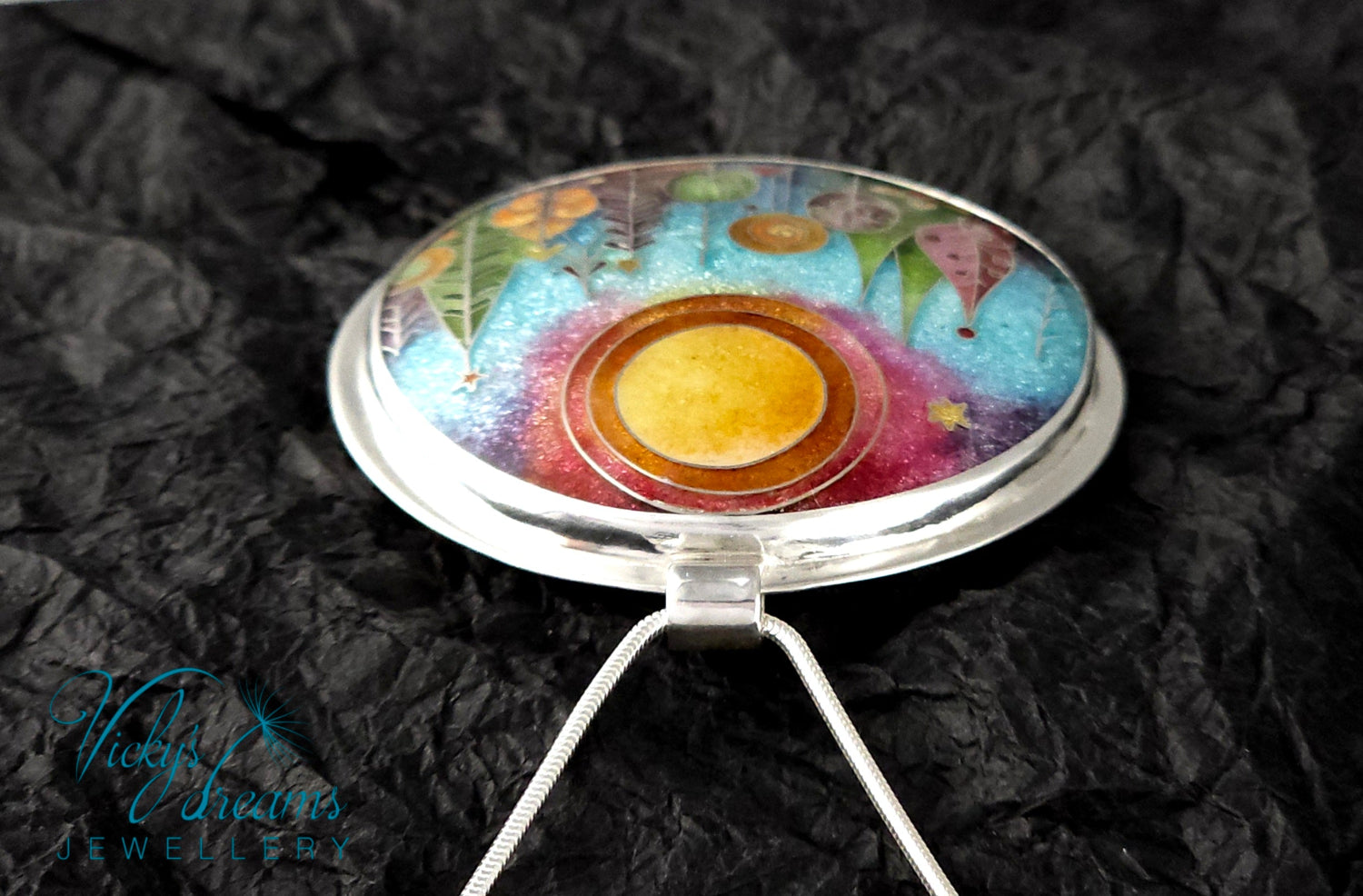 Handmade sterling silver cloisonné enamel pendant featuring a dreamlike forest with stylized trees, flowing lines, spiral motifs, and subtle stars