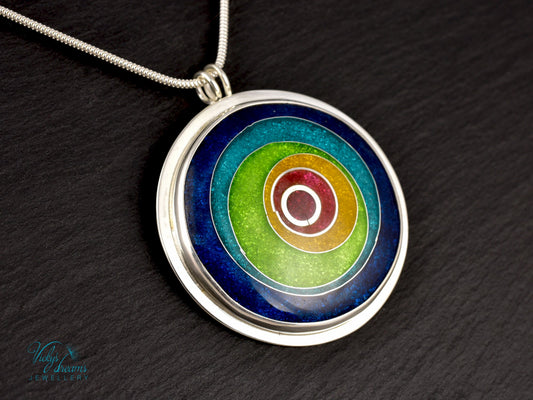 Handmade cloisonné enamel circles pendant in vibrant colors with sterling silver bezel