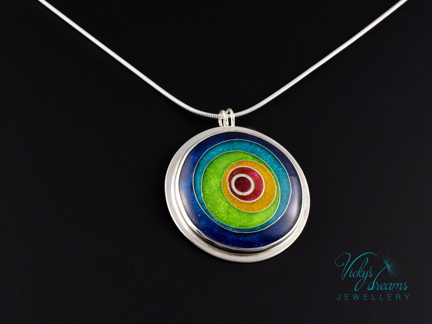 Handmade cloisonné enamel circles pendant in vibrant colors with sterling silver bezel
