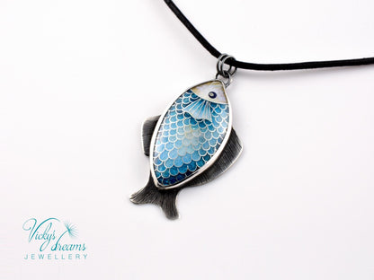 Hand-painted cloisonné enamel blue fish pendant in sterling silver setting.