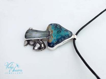 Jewelry with a blue and silver pendant on a white background