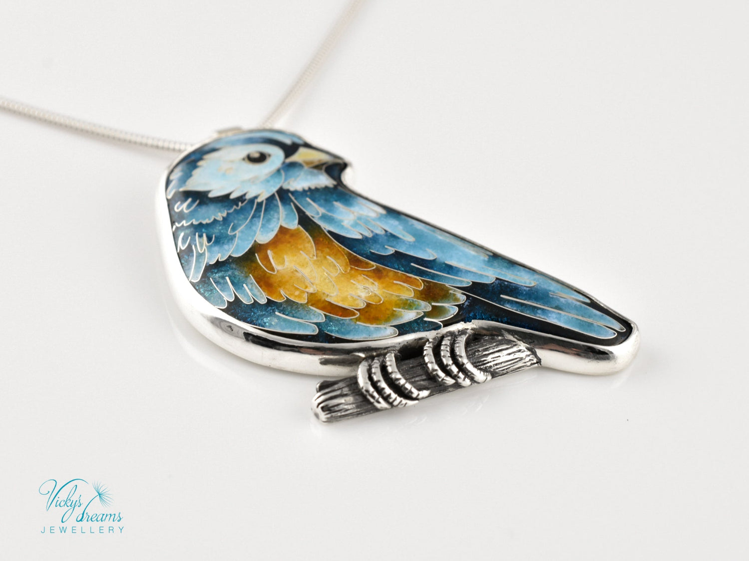 Bird-shaped pendant with blue and orange feathers 