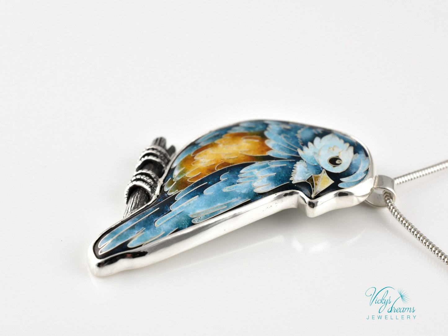 Bird-shaped pendant with blue and orange feathers 