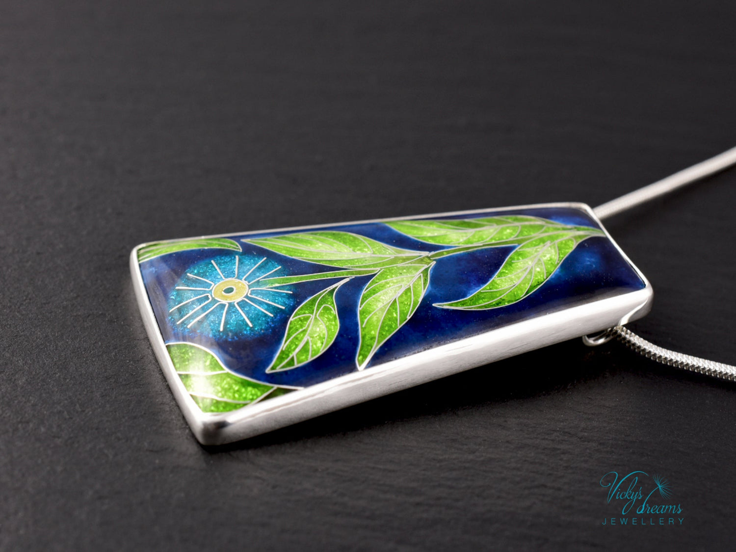 Handmade cloisonné enamel floral pendant on sterling silver necklace, vibrant botanical design