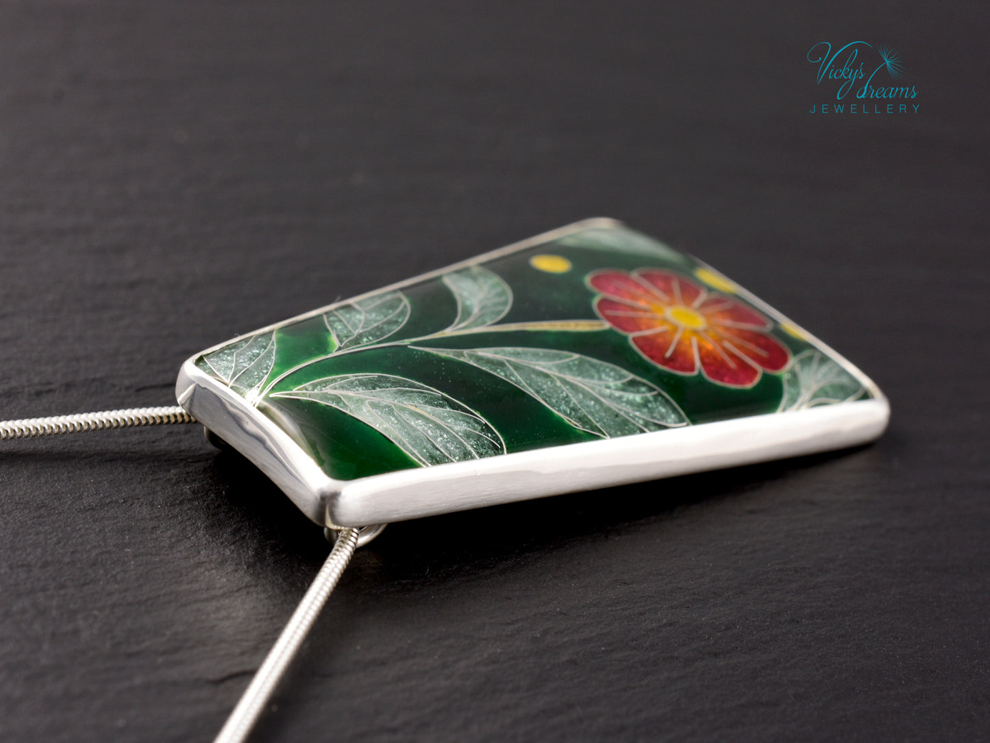 Handmade cloisonné enamel floral pendant on sterling silver necklace, vibrant botanical design