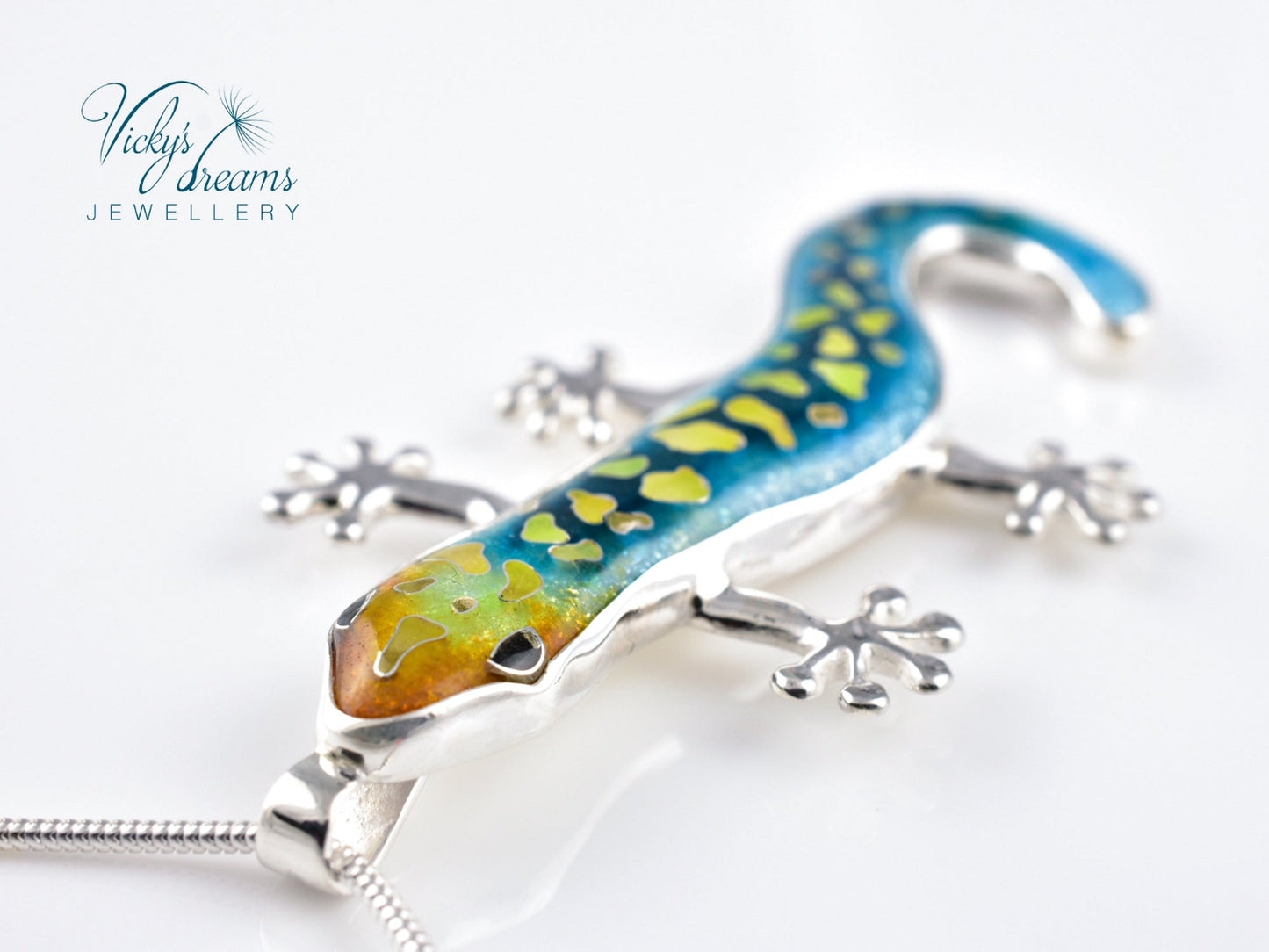 Handcrafted cloisonné enamel necklace with blue, yellow, and orange lizard design set in sterling silver.