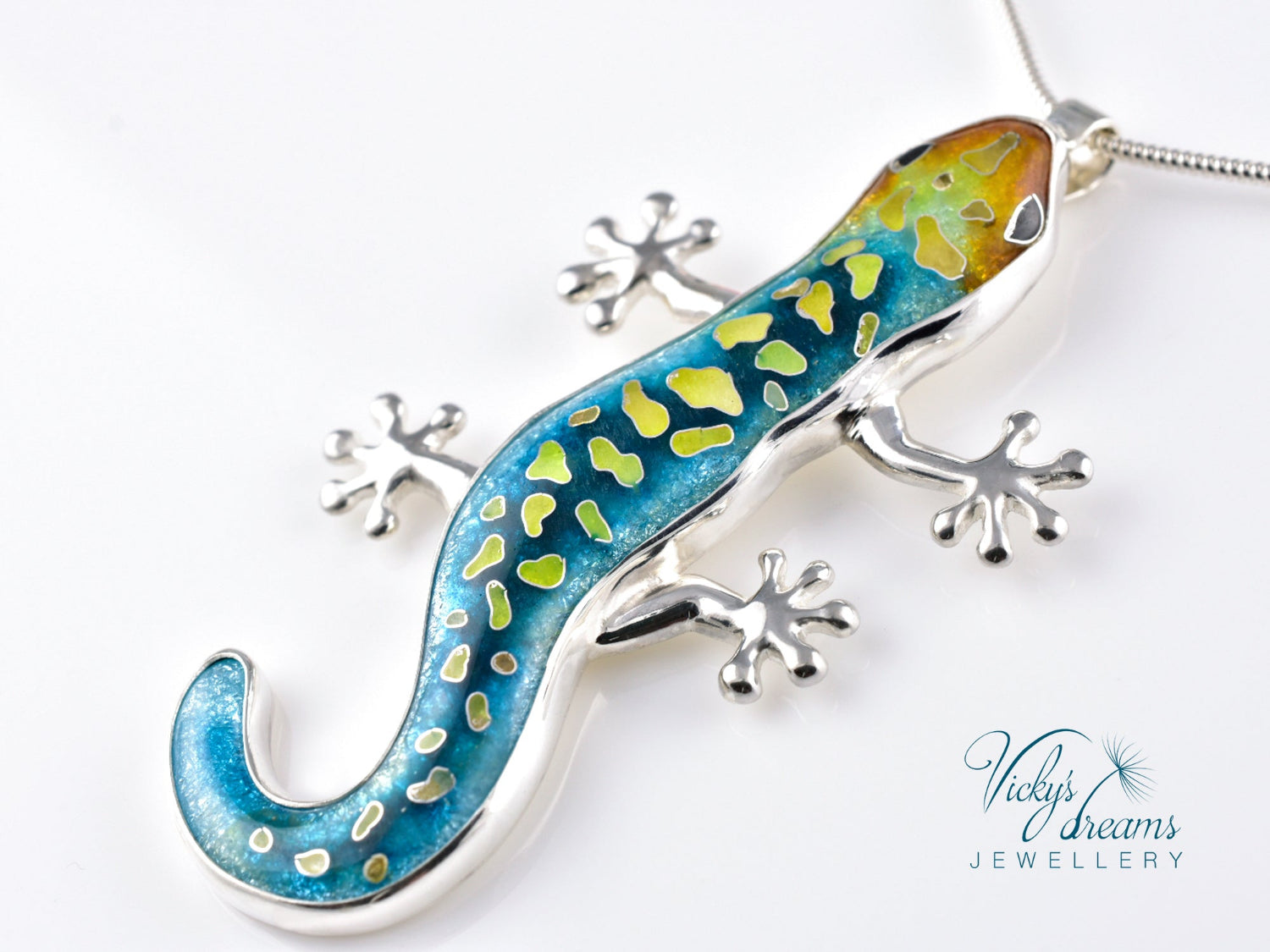 Handcrafted cloisonné enamel necklace with blue, yellow, and orange lizard design set in sterling silver.