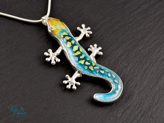Handcrafted cloisonné enamel necklace with blue, yellow, and orange lizard design set in sterling silver.
