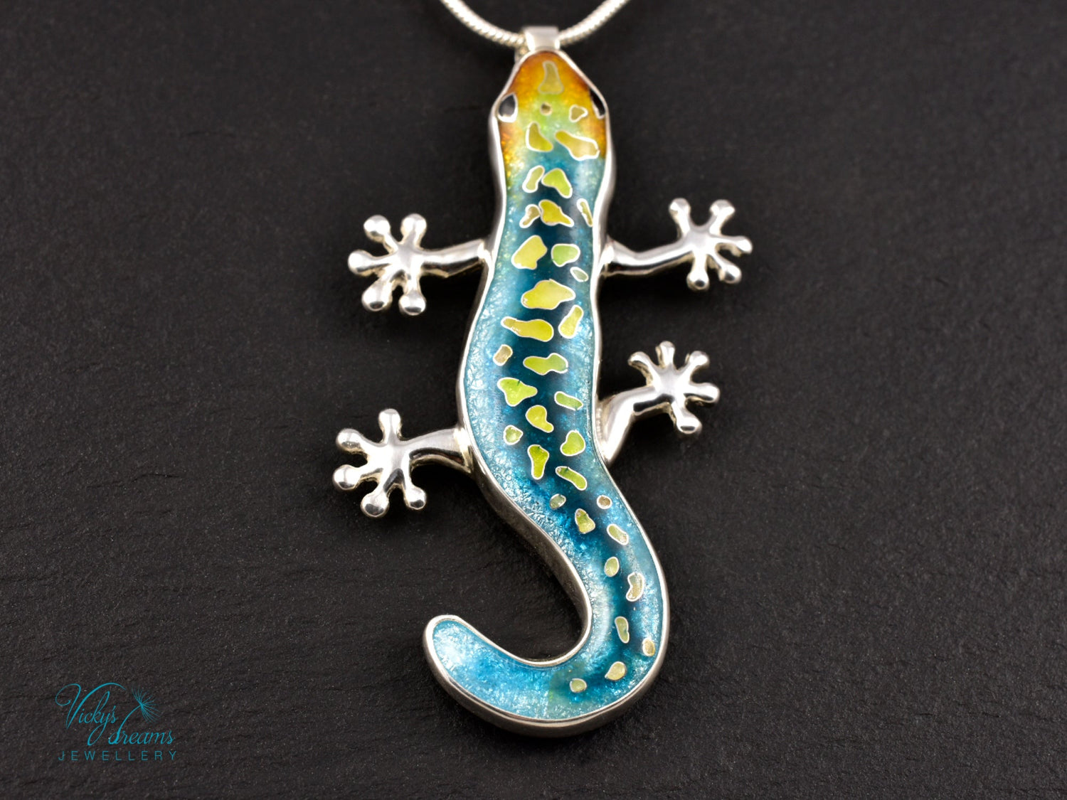 Handcrafted cloisonné enamel necklace with blue, yellow, and orange lizard design set in sterling silver.