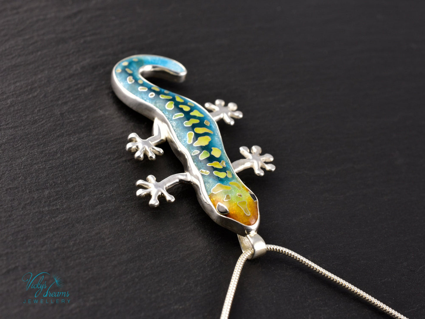 Handcrafted cloisonné enamel necklace with blue, yellow, and orange lizard design set in sterling silver.