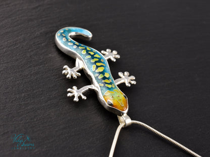Handcrafted cloisonné enamel necklace with blue, yellow, and orange lizard design set in sterling silver.