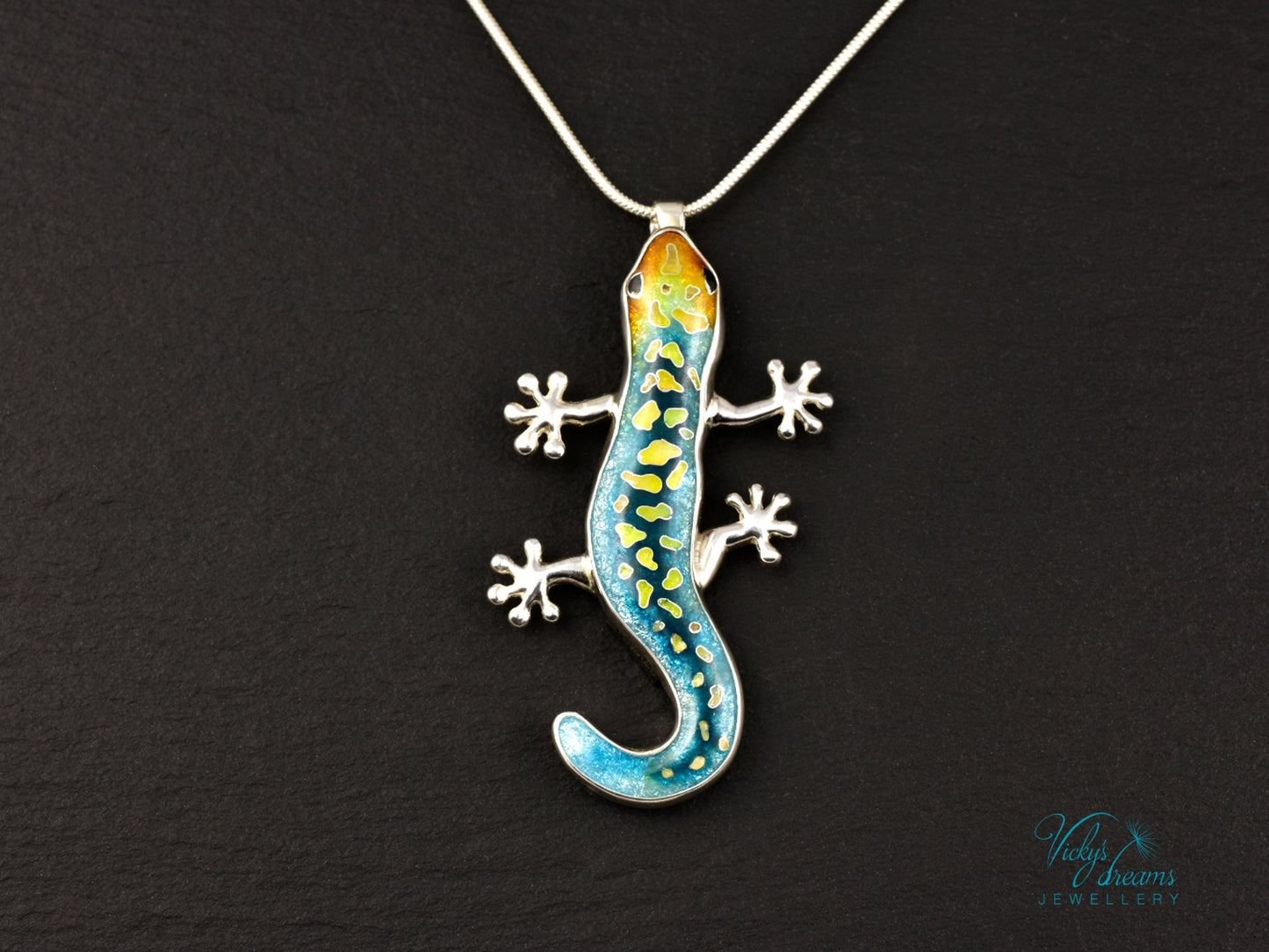 Handcrafted cloisonné enamel necklace with blue, yellow, and orange lizard design set in sterling silver.