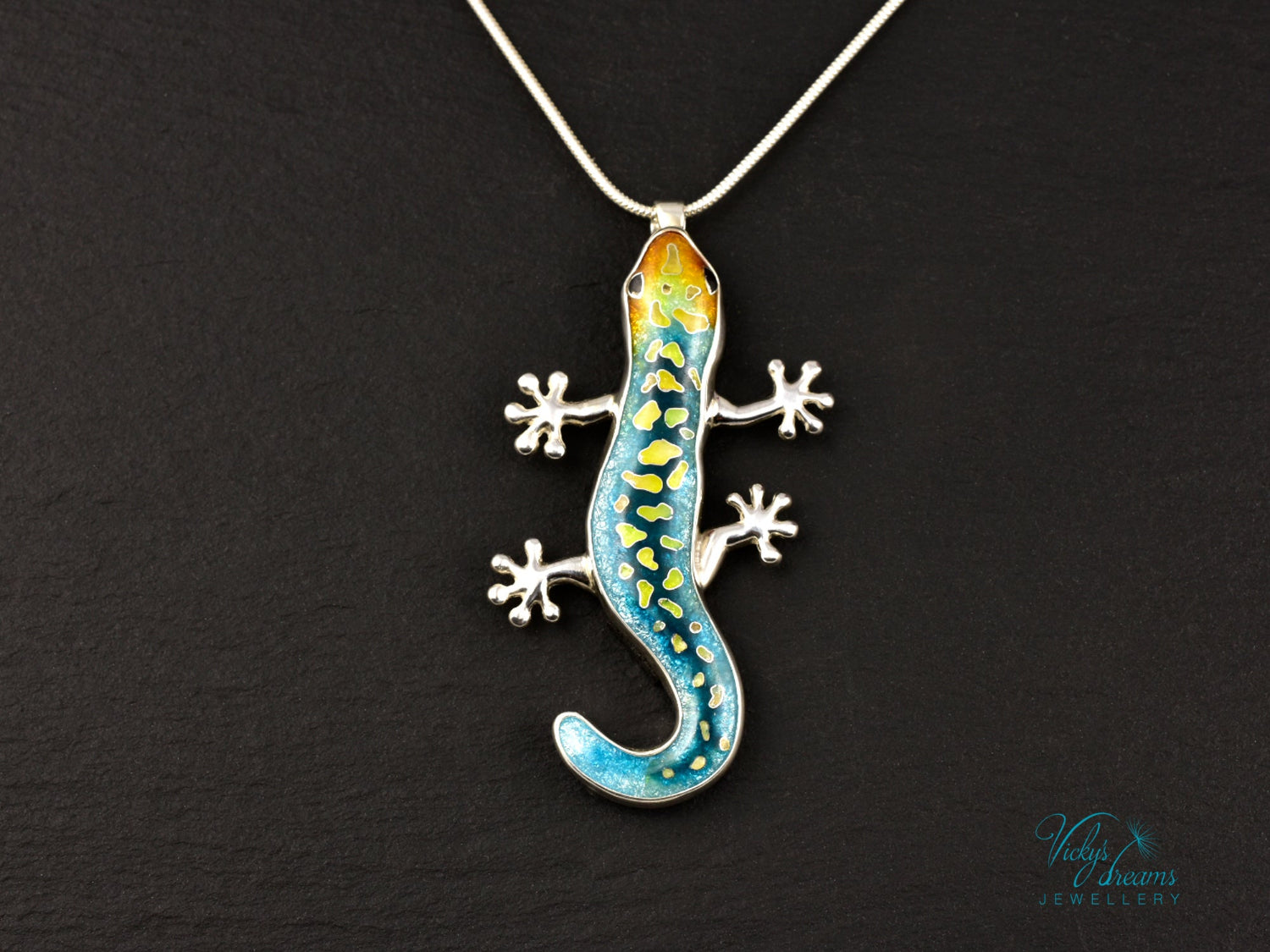 Handcrafted cloisonné enamel necklace with blue, yellow, and orange lizard design set in sterling silver.