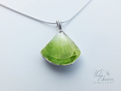 Green flower petal pendant worn on sterling silver necklace