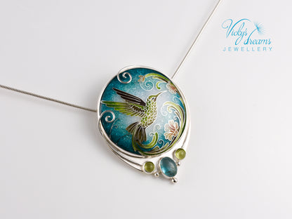 Handcrafted hummingbird pendant with cloisonné enamel and gemstone accents