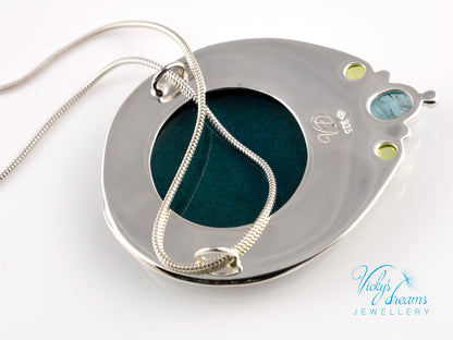 Handcrafted hummingbird pendant with cloisonné enamel and gemstone accents