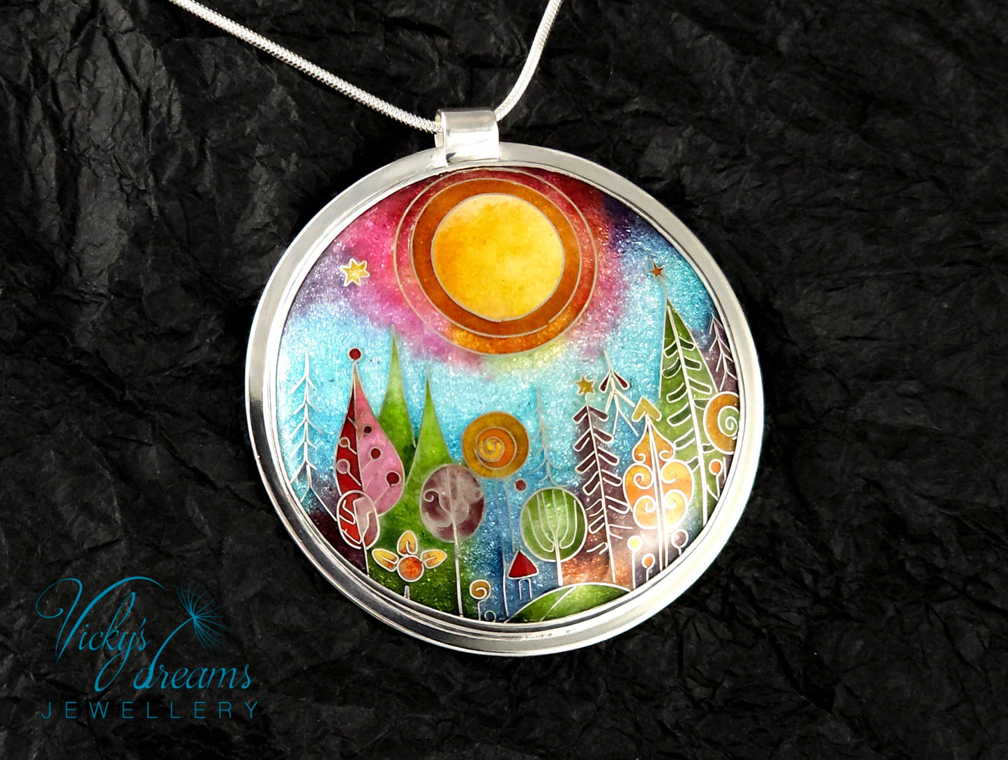 Handmade sterling silver cloisonné enamel pendant featuring a dreamlike forest with stylized trees, flowing lines, spiral motifs, and subtle stars