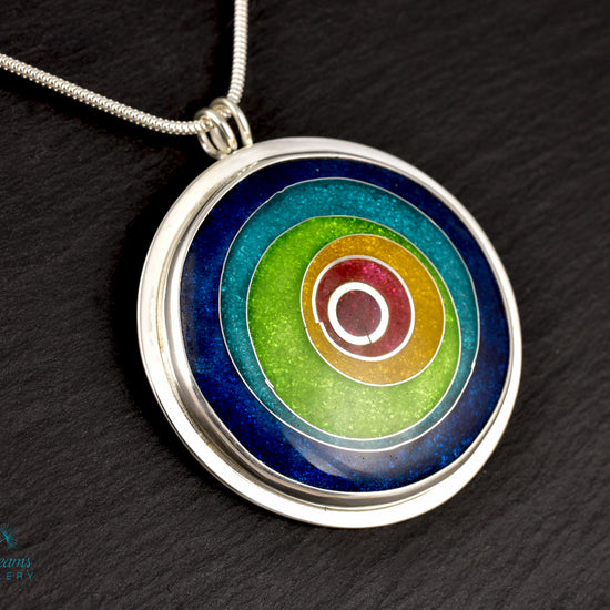 Handmade cloisonné enamel circles pendant in vibrant colors with sterling silver bezel