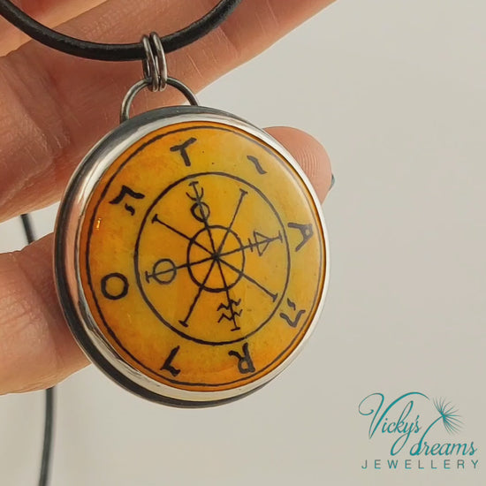 Hand painted enamel Wheel of Fortune tarot pendant in sterling silver and copper with leather cord