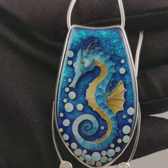 Handcrafted cloisonné seahorse pendant with vibrant enamel colors and rainbow moonstones