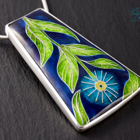 Handmade cloisonné enamel floral pendant on sterling silver necklace, vibrant botanical design