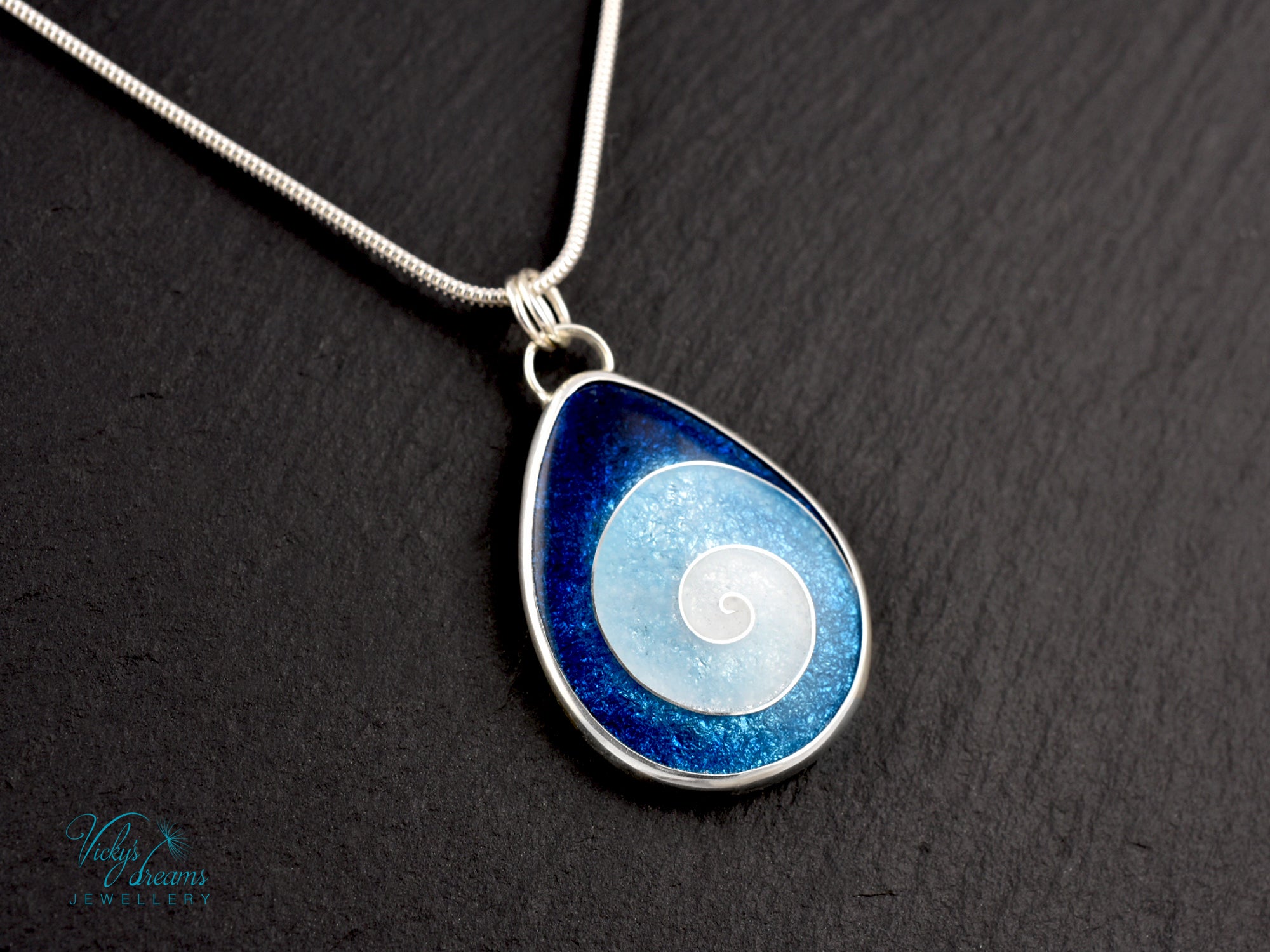 Handmade cloisonné enamel spiral pendant in blue and white, set in sterling silver