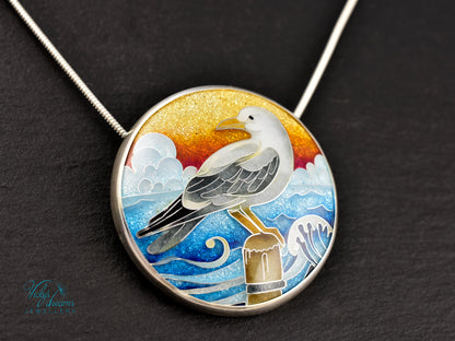 Handmade cloisonné seagull pendant necklace with sunset background