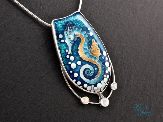 Handcrafted cloisonné seahorse pendant with vibrant enamel colors and rainbow moonstones
