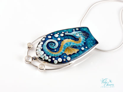 Handcrafted cloisonné seahorse pendant with vibrant enamel colors and rainbow moonstones