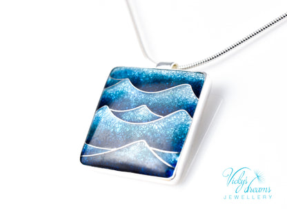 Bright blue cloisonné enamel necklace featuring ocean waves, set in sterling silver
