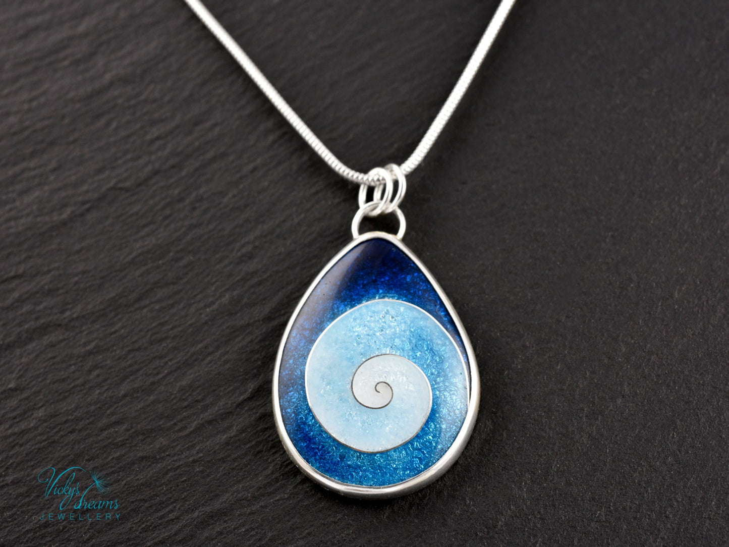 Handmade cloisonné enamel spiral pendant in blue and white, set in sterling silver