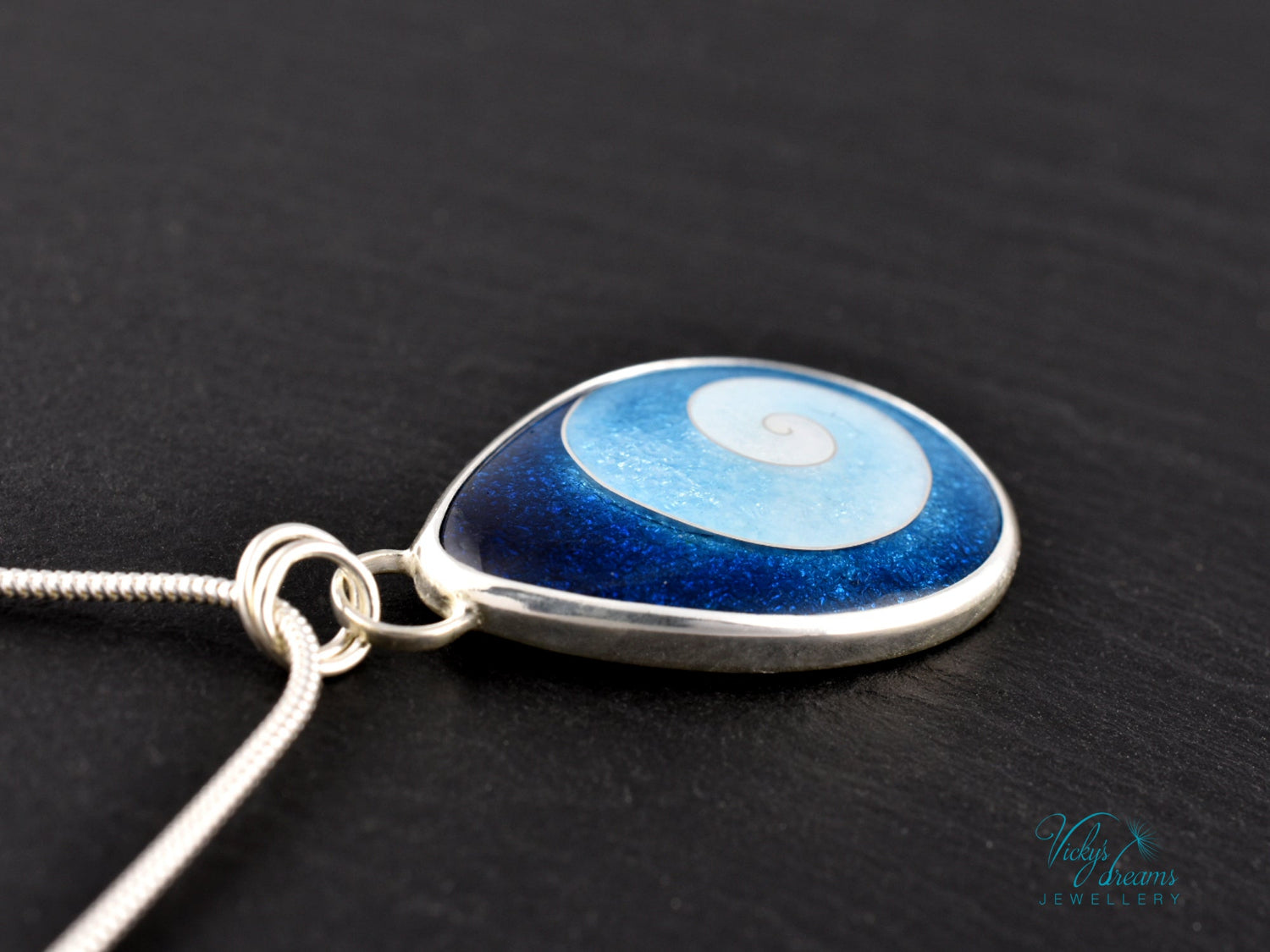Handmade cloisonné enamel spiral pendant in blue and white, set in sterling silver
