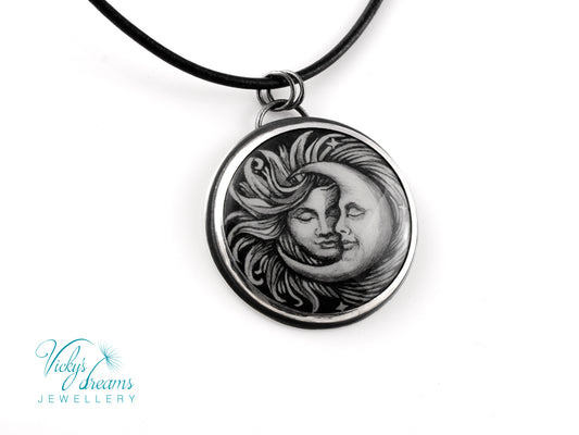 Handmade Sun and Moon enamel pendant necklace in sterling silver